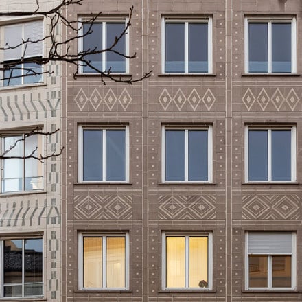 Existing ceramic façade – new windows.